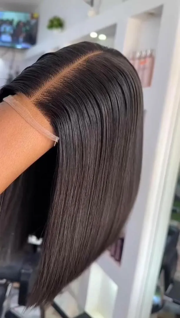 Silk-pressed sleek black bob with a sharp middle part