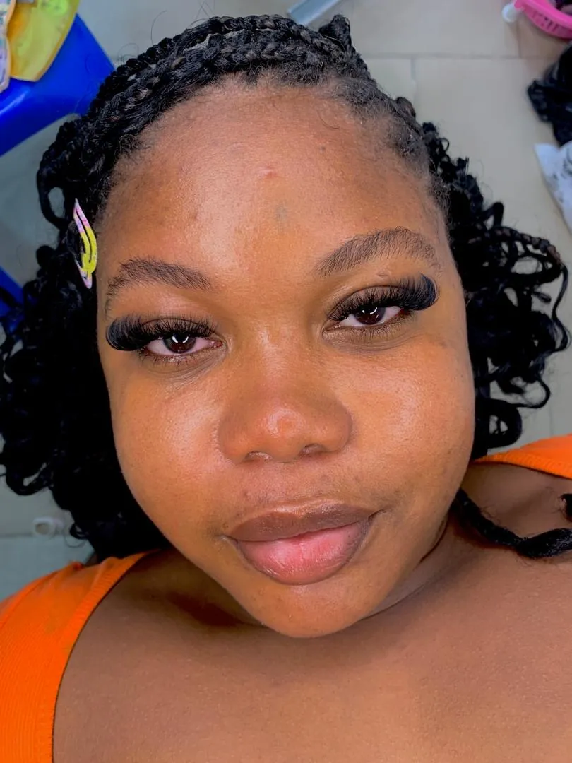 Signature braided style with sculpted brows and lash extensions