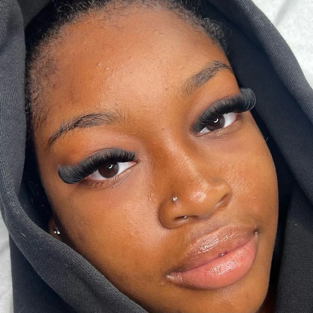 Client glow makeup finish with volume lash extensions