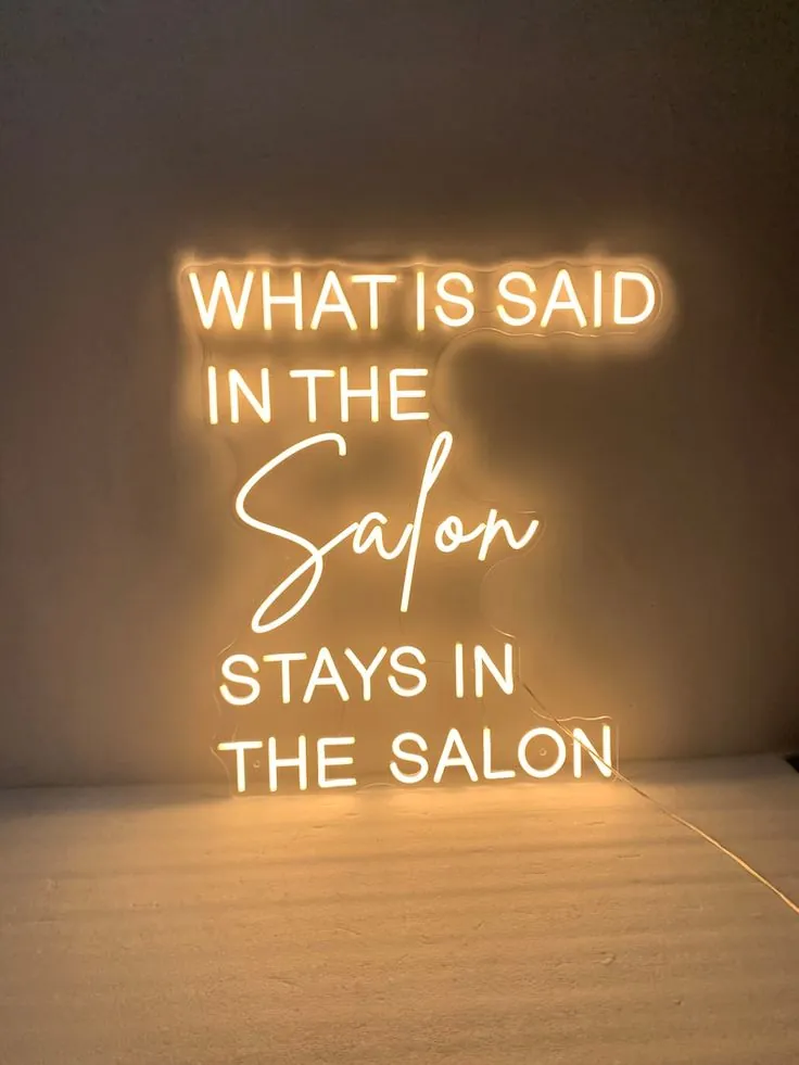 Neon sign reading salon secrets