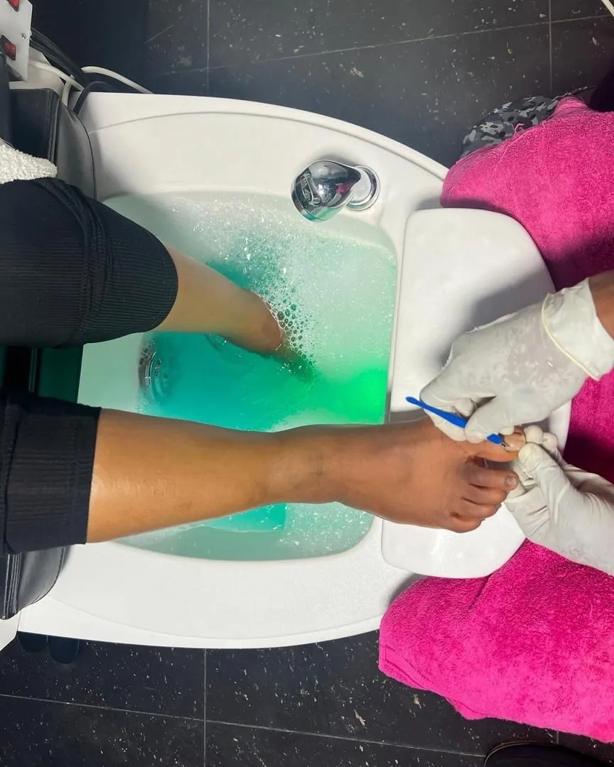 Spa pedicure ritual in a bubbling basin