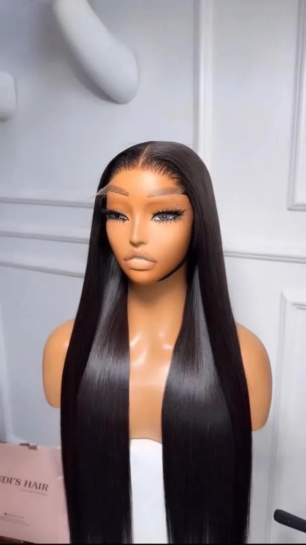 Long sleek raw human hair wig styled on a display mannequin